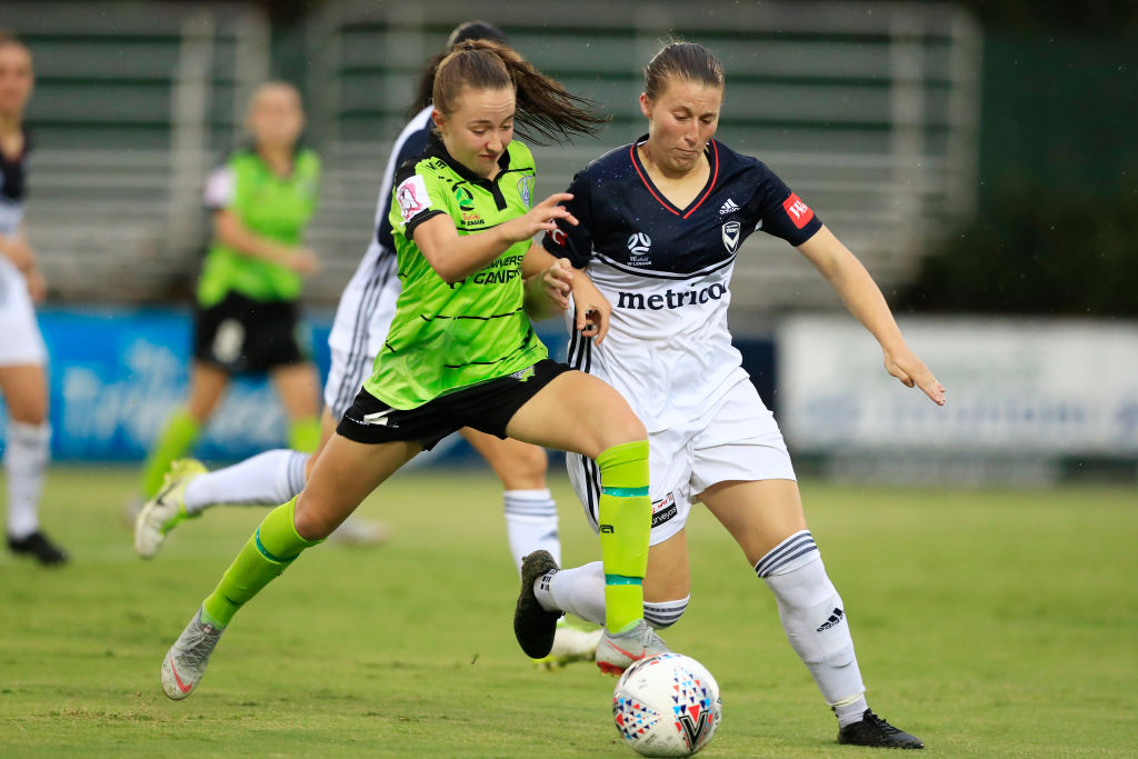 Laura Hughes is tackled during the round 12 W-League match between Canberra United and the Melbourne Victory at McKellar Park last season. Getty Images. 